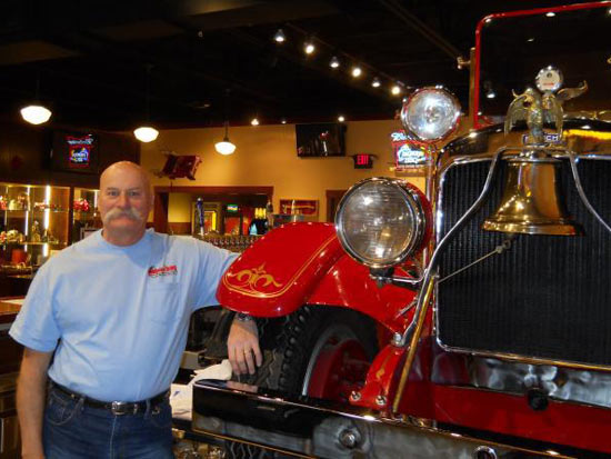 Captain Bill with Company 7 BBQ's Fire Engine Behind the Company 7 Bar Captain Bill with Company 7 BBQ's Fire Engine Behind the Company 7 Bar